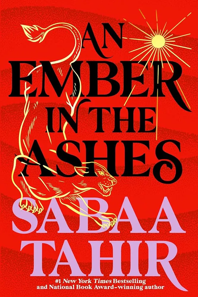 Red book cover of "An Ember in the Ashes" by Sabaa Tahir. A stylized gold lion is beneath the title, with a sun design above. Bold and dramatic.