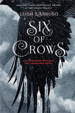 Cover of "Six of Crows" by Leigh Bardugo, featuring a large black crow with outstretched wings against a cloudy sky. Gothic architecture is silhouetted below.
